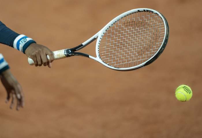 Sep 27, 2020; Paris, France; Cori Gauff (USA) reaches for the ball prior to her serve during her match against Johanna Konta (GBR) on day one at Stade Roland Garros. Mandatory Credit: Susan Mullane-USA TODAY Sports